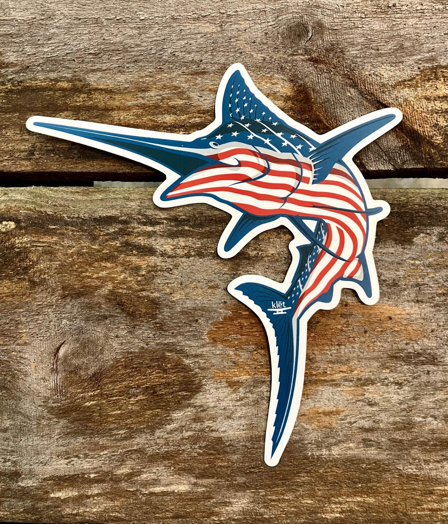 Klēt 8-inch Marlin sticker with American flag stripes on wooden background Klēt - America Stripe Marlin Sticker