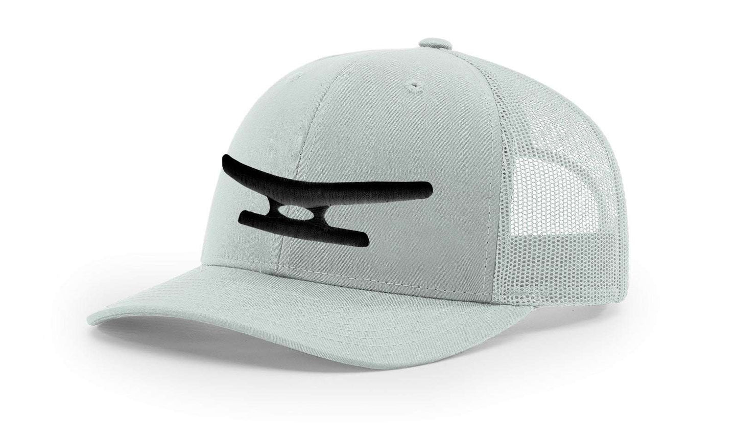 Light grey mesh baseball cap with black puff embroidered Klēt monogram on front panel