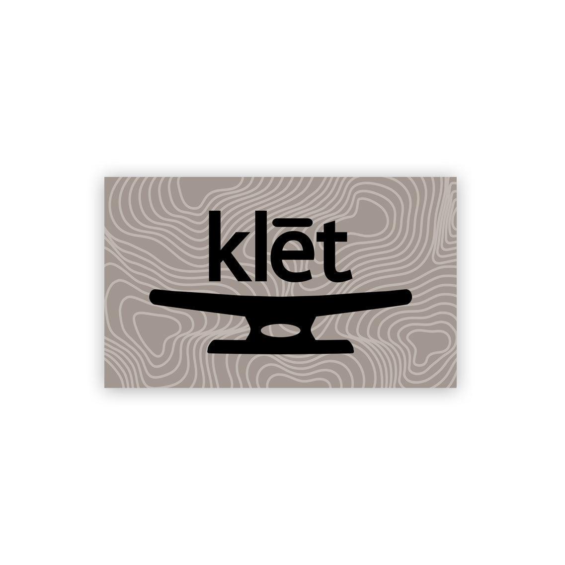 Klēt Open Sea 5-inch sticker with minimalist black design on gray topographic background
