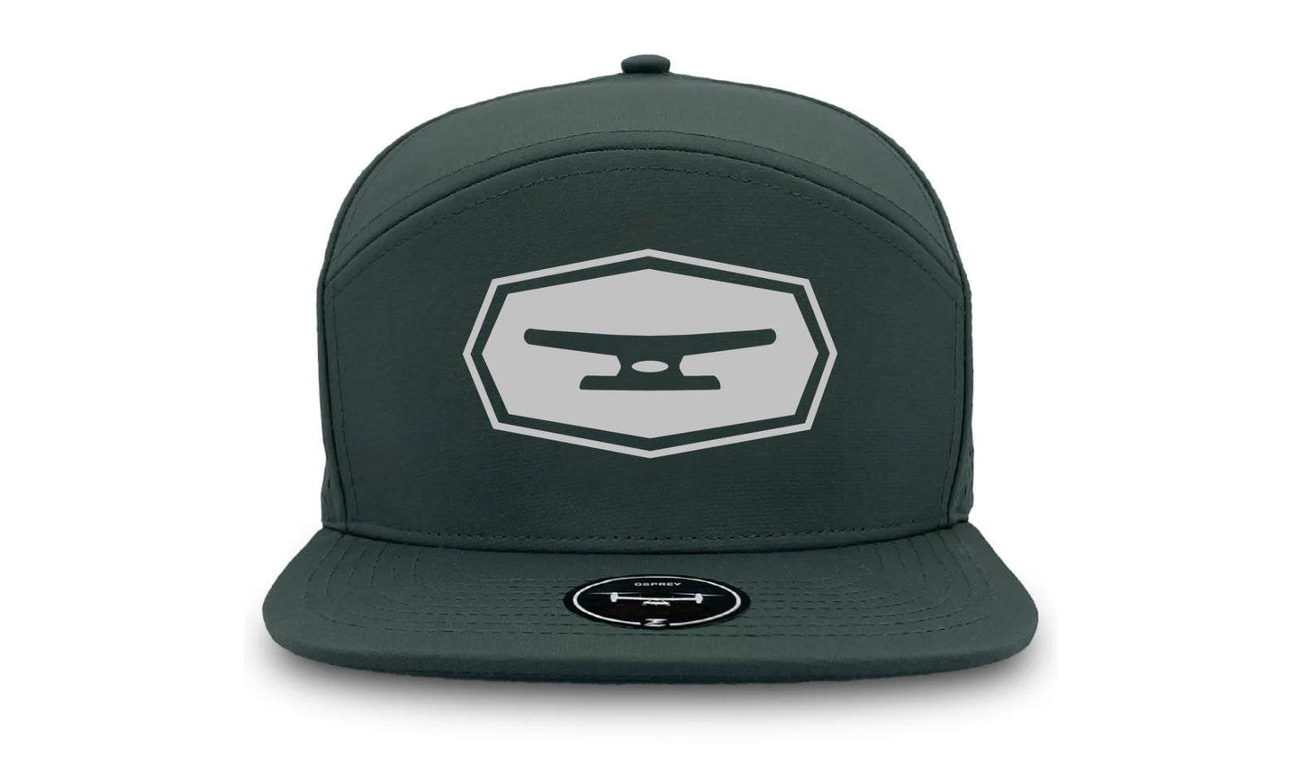 Klēt Osprey Flatbill Perf Hat in dark green with water repellent structured polyester and perforated panels for breathability, featuring a flat bill and medium-profile crown.